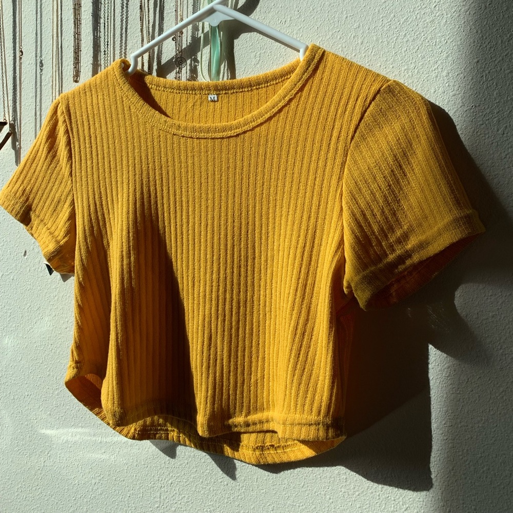 Yellow crop top.